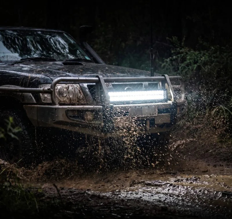 An ION-D42 light bar lit up on a muddy rig